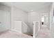 Upstairs hallway with neutral paint, carpet, and doors provides access to the various rooms of the house at 15126 Shallow Ridge Rd, Charlotte, NC 28278