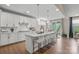 Bright and spacious kitchen with an island, modern appliances, white cabinets, and an adjacent dining area at 15126 Shallow Ridge Rd, Charlotte, NC 28278