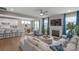 Open-concept living room featuring a fireplace, comfortable seating, and an adjacent kitchen and dining area at 15126 Shallow Ridge Rd, Charlotte, NC 28278