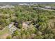 Aerial view of a house nestled among mature trees in a tranquil, residential neighborhood at 157 Fraley Rd, Gastonia, NC 28052