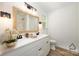 Bathroom boasts a dual vanity, framed mirror, and decor at 157 Fraley Rd, Gastonia, NC 28052