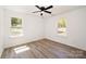 Bedroom with windows offering views and a ceiling fan at 157 Fraley Rd, Gastonia, NC 28052