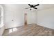 Bright bedroom features a ceiling fan, two closets, and neutral paint at 157 Fraley Rd, Gastonia, NC 28052