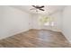 A spacious bedroom with a fan and large windows for ample natural light at 157 Fraley Rd, Gastonia, NC 28052