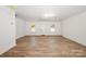 The space features light wood flooring, neutral walls, recessed lighting and lots of natural light from the windows at 157 Fraley Rd, Gastonia, NC 28052