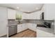 Bright kitchen boasts granite countertops, stainless appliances, and modern backsplash at 157 Fraley Rd, Gastonia, NC 28052
