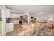 The home features an open floor plan with a kitchen, dining area, and living room; wood floors and neutral tones throughout at 157 Fraley Rd, Gastonia, NC 28052