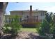 View of backyard featuring a spacious deck and a sunroom with a lot of light exposure at 15964 Cumnor Ln, Charlotte, NC 28277