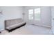 Cozy bedroom with a futon, carpet, and large windows at 15964 Cumnor Ln, Charlotte, NC 28277
