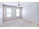 Bright, spacious bedroom with large windows and neutral carpeting throughout at 15964 Cumnor Ln, Charlotte, NC 28277