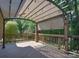 Beautiful deck overlooking a lush backyard, complete with shade covering and wood railing at 15964 Cumnor Ln, Charlotte, NC 28277