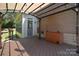 Covered deck with ambient lighting, wood floors and backyard access at 15964 Cumnor Ln, Charlotte, NC 28277