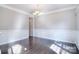 Formal dining room with wainscoting, hardwood floors and natural light at 15964 Cumnor Ln, Charlotte, NC 28277