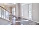 Bright entryway featuring hardwood floors, staircase, and natural light at 15964 Cumnor Ln, Charlotte, NC 28277