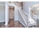 Elegant entryway features hardwood floors, a staircase, and white trim, creating a welcoming first impression at 15964 Cumnor Ln, Charlotte, NC 28277