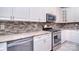 Close-up of modern kitchen with stainless steel appliances and granite countertops at 15964 Cumnor Ln, Charlotte, NC 28277