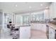Open concept kitchen with granite countertops, stainless appliances, and adjacent breakfast nook at 15964 Cumnor Ln, Charlotte, NC 28277