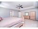 Spacious main bedroom with ceiling fan, neutral carpet and paint, offering a blank slate for personalization at 15964 Cumnor Ln, Charlotte, NC 28277