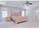 Large main bedroom with a tray ceiling, windows, carpet, and neutral walls, offering a peaceful atmosphere at 15964 Cumnor Ln, Charlotte, NC 28277