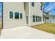 Backyard with patio and view of house siding and windows at 162 Aspire Cir, Wingate, NC 28174
