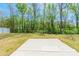 Backyard with a concrete patio pad and lush greenery at 162 Aspire Cir, Wingate, NC 28174