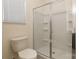 Bathroom featuring a toilet and shower with a sliding glass door and built-in shelving at 162 Aspire Cir, Wingate, NC 28174