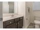 Cozy bathroom with neutral cabinets, white countertop and a framed mirror at 162 Aspire Cir, Wingate, NC 28174