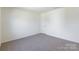 Bedroom with neutral-colored carpet and a door at 162 Aspire Cir, Wingate, NC 28174
