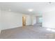 Open bedroom layout featuring neutral carpet and a large open space at 162 Aspire Cir, Wingate, NC 28174
