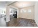 Dining room with hardwood floors, a chandelier, and a view into the kitchen at 162 Aspire Cir, Wingate, NC 28174