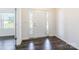 Entryway with hardwood floors, white walls, and a white front door with sidelights at 162 Aspire Cir, Wingate, NC 28174