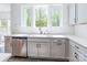 Bright kitchen with stainless steel appliances, undermount sink, and large windows overlooking the outside at 162 Aspire Cir, Wingate, NC 28174