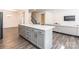 Spacious kitchen island with storage, drawers and seating that overlooks an open living space at 162 Aspire Cir, Wingate, NC 28174