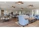 Spacious clubhouse with neutral walls and wood floors has a cozy seating area and dining space at 19650 Harbor Watch Ct, Lancaster, SC 29720