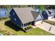 Aerial view of a two-story home with a large yard, an attached garage, and a lake view at 19650 Harbor Watch Ct, Lancaster, SC 29720