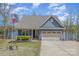 This two-story home has a traditional exterior, attached garage, and a neatly landscaped yard at 19650 Harbor Watch Ct, Lancaster, SC 29720