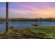 Scenic lake view with a private dock and lush greenery, providing a tranquil setting for outdoor activities and relaxation at 19650 Harbor Watch Ct, Lancaster, SC 29720