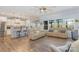 Open-concept living area featuring wood floors, stainless steel appliances and neutral paint at 19650 Harbor Watch Ct, Lancaster, SC 29720