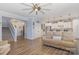 Open-concept living room featuring wood floors, neutral paint, and staircase at 19650 Harbor Watch Ct, Lancaster, SC 29720