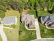 Beautiful aerial view of the home showcasing mature landscaping and a long driveway at 202 Weeping Spring Dr, Mooresville, NC 28115