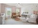 Charming Bedroom with neutral tones, natural light, and a cozy rocking chair at 202 Weeping Spring Dr, Mooresville, NC 28115