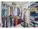 Walk-in closet with custom shelving and hanging racks for organization at 202 Weeping Spring Dr, Mooresville, NC 28115
