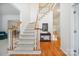 Spacious foyer with hardwood floors and staircase, providing an elegant and open entrance to the home at 202 Weeping Spring Dr, Mooresville, NC 28115