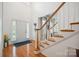 Inviting foyer with hardwood floors, staircase, and ample natural light, creating a warm and welcoming entrance at 202 Weeping Spring Dr, Mooresville, NC 28115