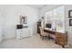 Bright home office featuring a modern desk, stylish white dresser, and natural light from a large window at 202 Weeping Spring Dr, Mooresville, NC 28115