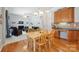 Open-concept living space with a dining area and a seamless transition to the kitchen and living room at 202 Weeping Spring Dr, Mooresville, NC 28115