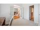 Home office space showcasing neutral carpet and view of the front foyer at 202 Weeping Spring Dr, Mooresville, NC 28115