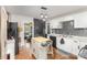 Bright kitchen featuring white cabinets, center island and stainless steel appliances at 206 Friedheim Rd, Rock Hill, SC 29730