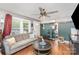 Cozy living room featuring a gray sofa, decor and wood-look flooring at 206 Friedheim Rd, Rock Hill, SC 29730