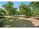 Large backyard is nicely shaded and offers a tranquil setting with mature trees at 2115 Fowler Secrest Rd, Monroe, NC 28110